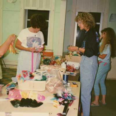 Unknown woman working on making face mask.
