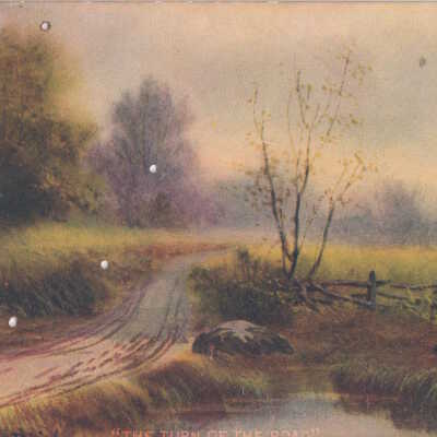 Road curving through a field