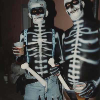 Two unknown people dressed up.