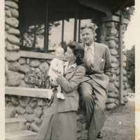 An unknown couple with a baby