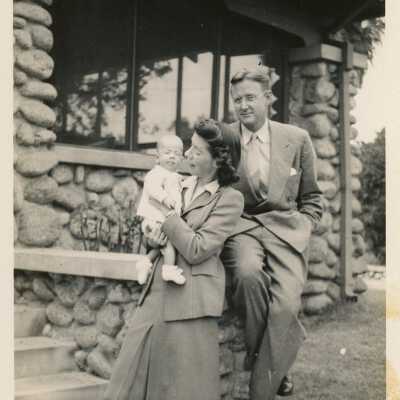 An unknown couple with a baby