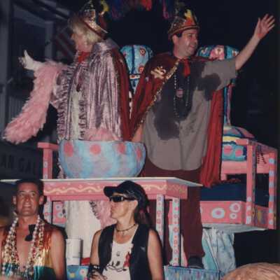 Unknown people dressed up on a float.