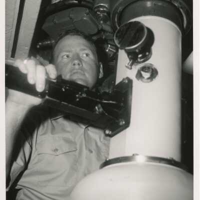 An unknown man in uniform on a ship