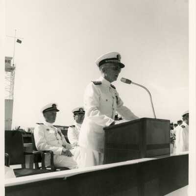 Unknown man in uniform talking at the podium
