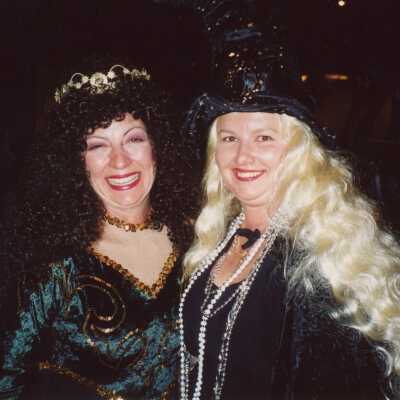 Two unknown woman dressed up.