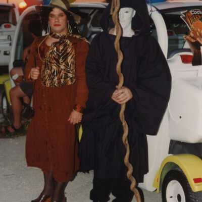 Two unknown people dressed up.