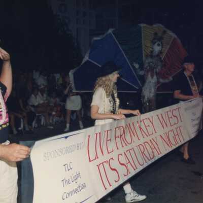 Unknown people holding a banner that reads live from Key West, its Saturday night.