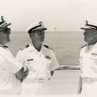 3 Men in uniform talking outside