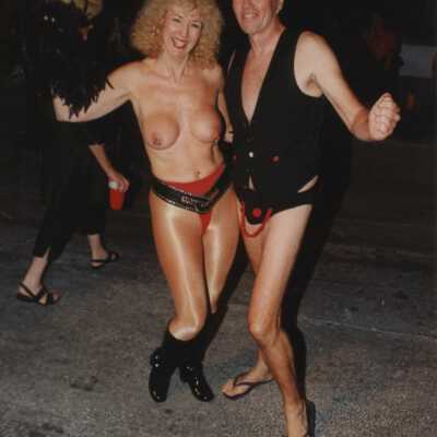 Two unknown people dressed up.