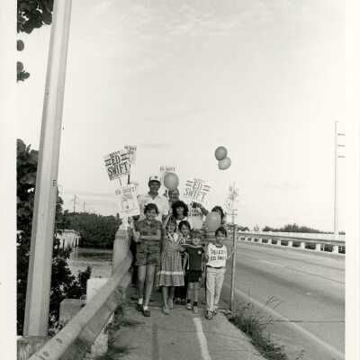 Unknown people holding up election signs