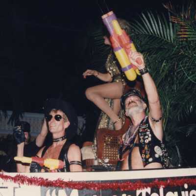 Unknown people dressed up on a float.