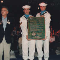 Joe Pais receiving the MAINE Memorial Plaque