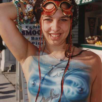 Unknown lady with her breast painted.