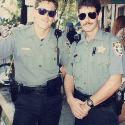 Two unknown cops.