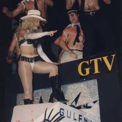 Unknown people dressed up on a float.