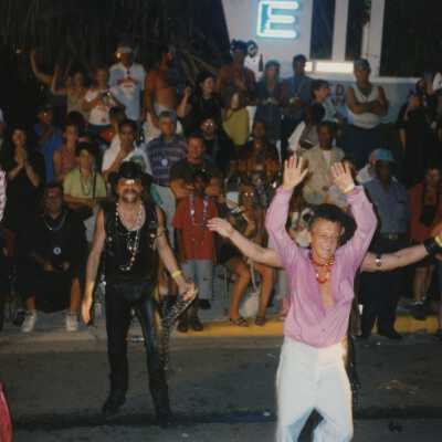 Unknown people dressed up in the street for the parade.