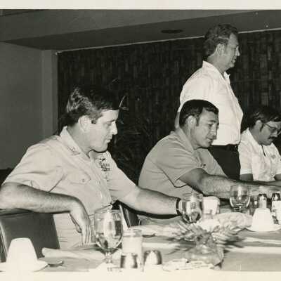 Unknown men at a ceremony