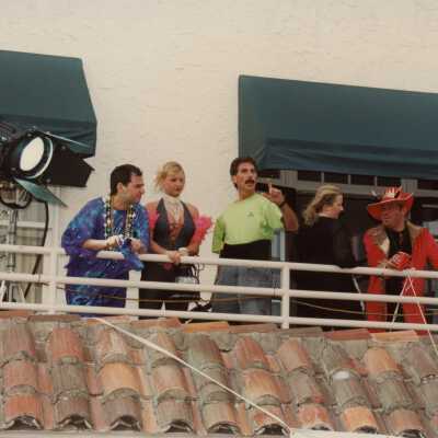 Unknown people on a balcony.