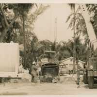 An unknown guy working on something outside
