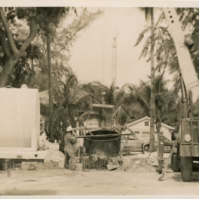 An unknown guy working on something outside