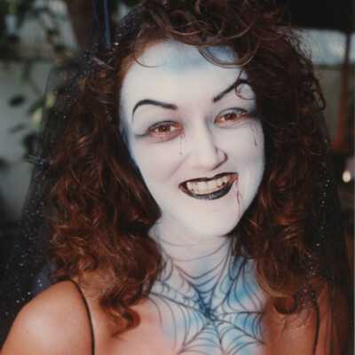 Unknown lady with her face painted.