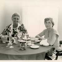 2 Unknown woman at a table