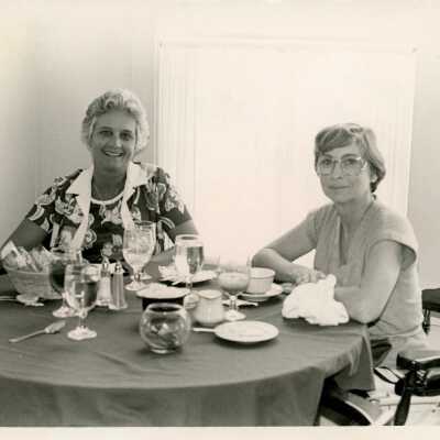 2 Unknown woman at a table