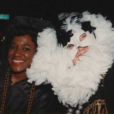 Two unknown people dressed up.