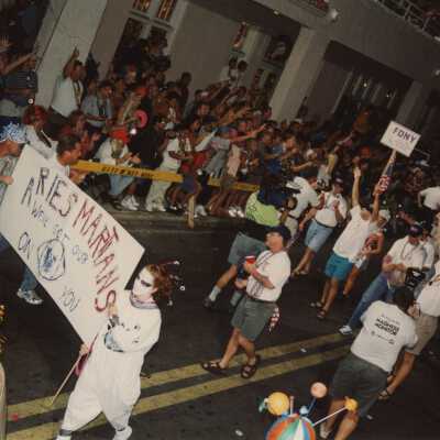 Unknown people walking in the parade.