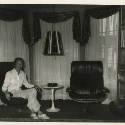 Unknown woman sitting in a living room