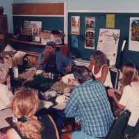 A group of unknown people making face masks.