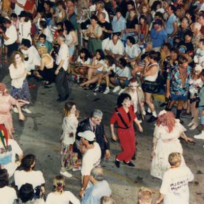 Unknown people walking in the parade.