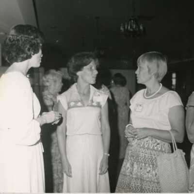 Unknown woman talking at a party