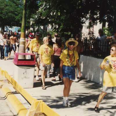 Unknown people walking down the side walk.