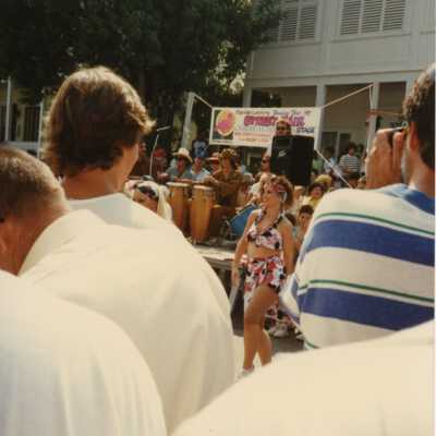 Unknown people at a street fair.