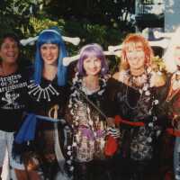 Five unknown woman dressed up.