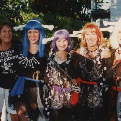 Five unknown woman dressed up.