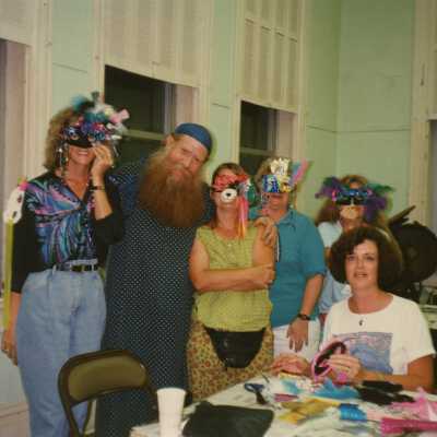 Unknown people working on face mask.