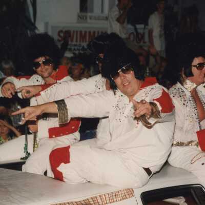 Unknown people on a float dressed up as Elvis.