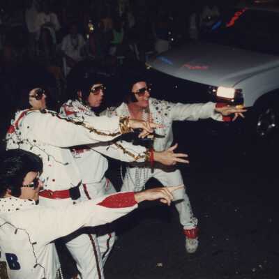 Four unknown men dressed up as Elvis in the parade.