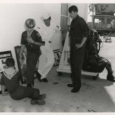 U.S. Navy men with boy scouts