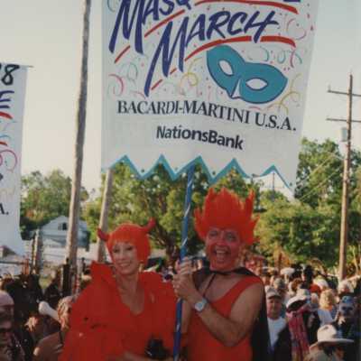 Two unknown people dressed up holding a FF 98 banner.