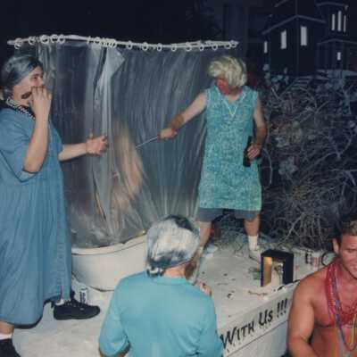 Unknown people dressed up on a float.