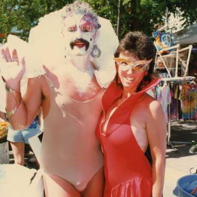 Two unknown people dressed up.