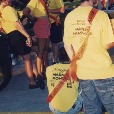 Unknown people wearing yellow shirts.