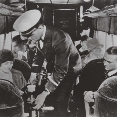 Passengers and steward on airplane