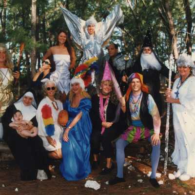 A group of unknown people dressed up.