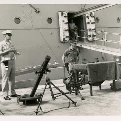U.S. Navy ship and men doing work