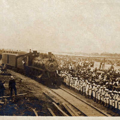 Sailors lining the tracks as a train approaches