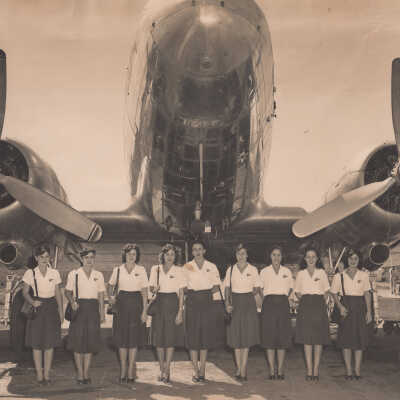 Flight attendants with plane